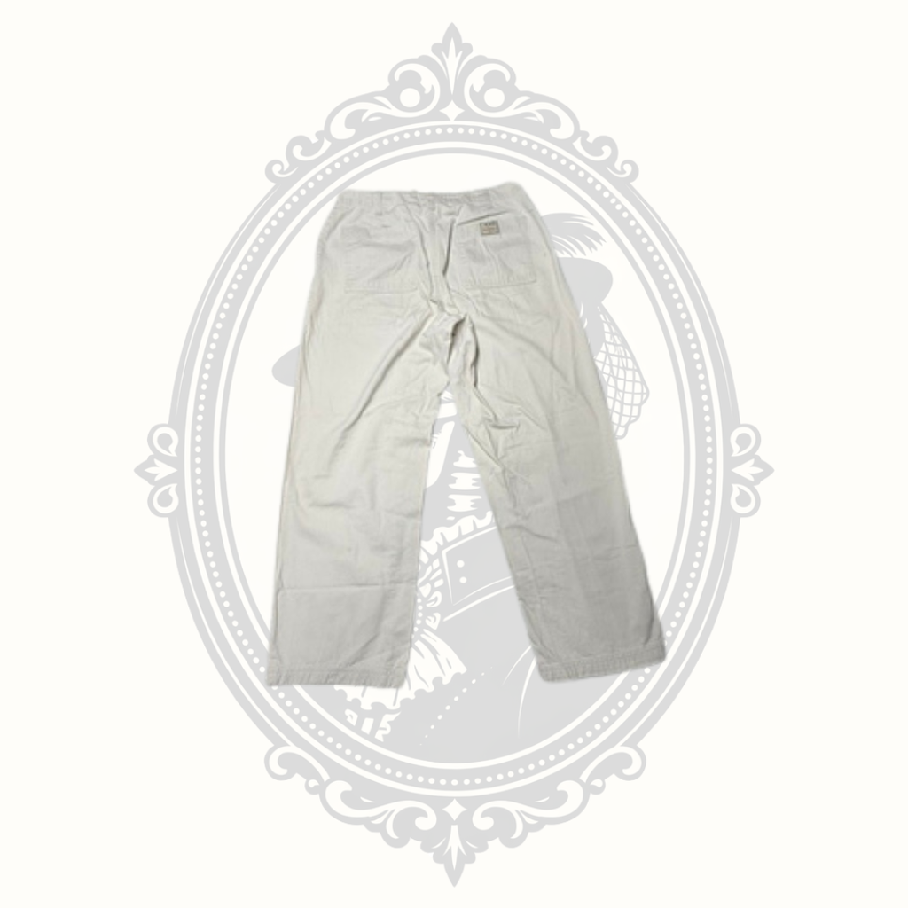 Rear view of Bill Blass women's beige cotton pants.