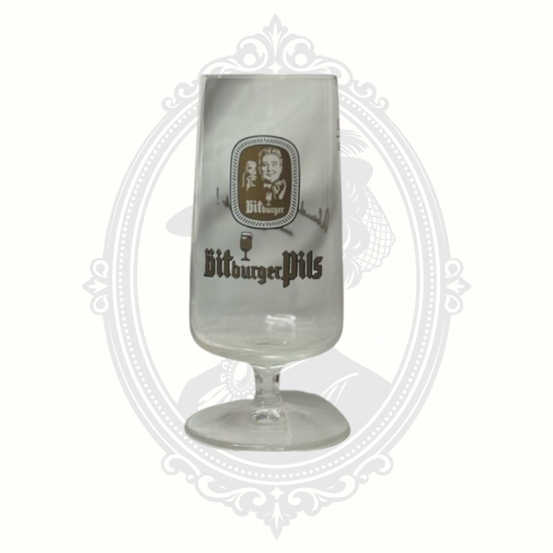 Front view of Bitburger pilsner beer glass with tall tapered silhouette and printed logo.