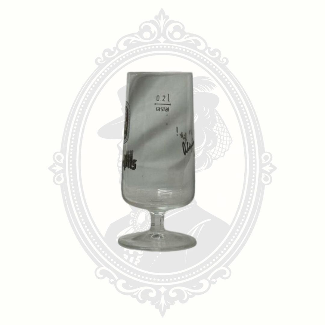 Detail view of Rastal branding and etched markings on Bitburger pilsner glass.