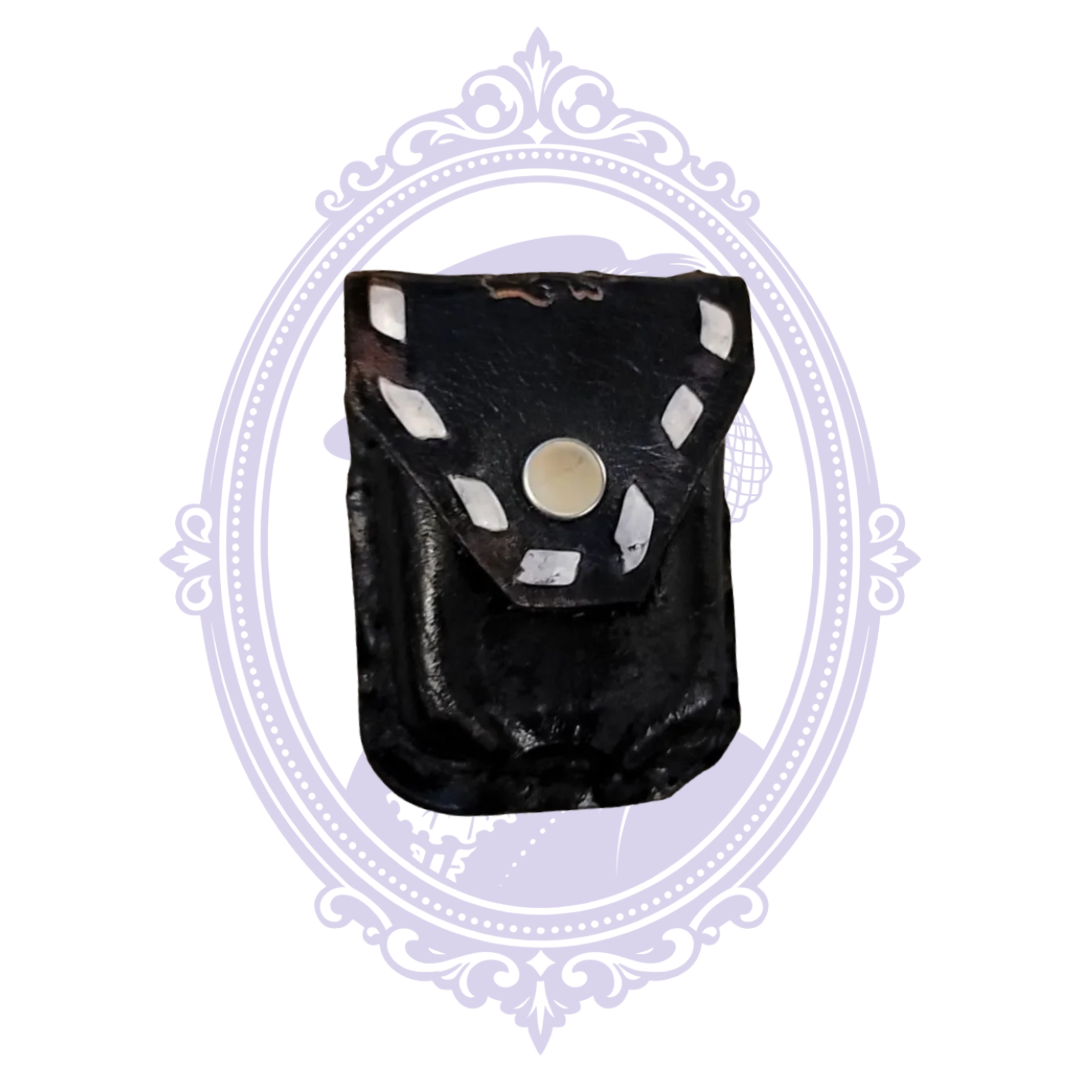 Black leather bull rider mini pouch with measuring tape showing height