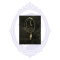 Black coffin pendant necklace with raised silver-tone skull and adjustable black cord.
