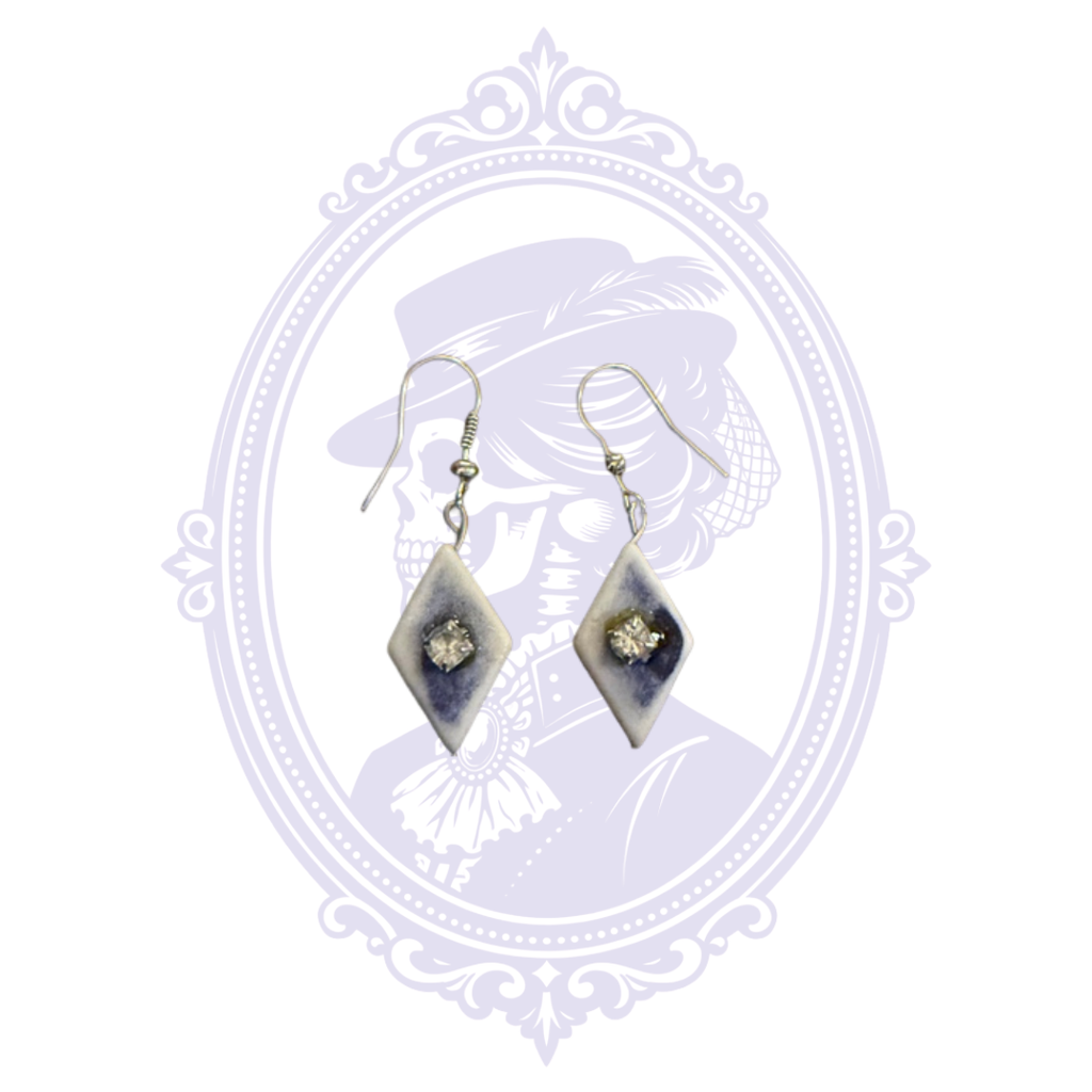 Full front view of pre-owned blue and white diamond dangle earrings with silver-tone hooks.