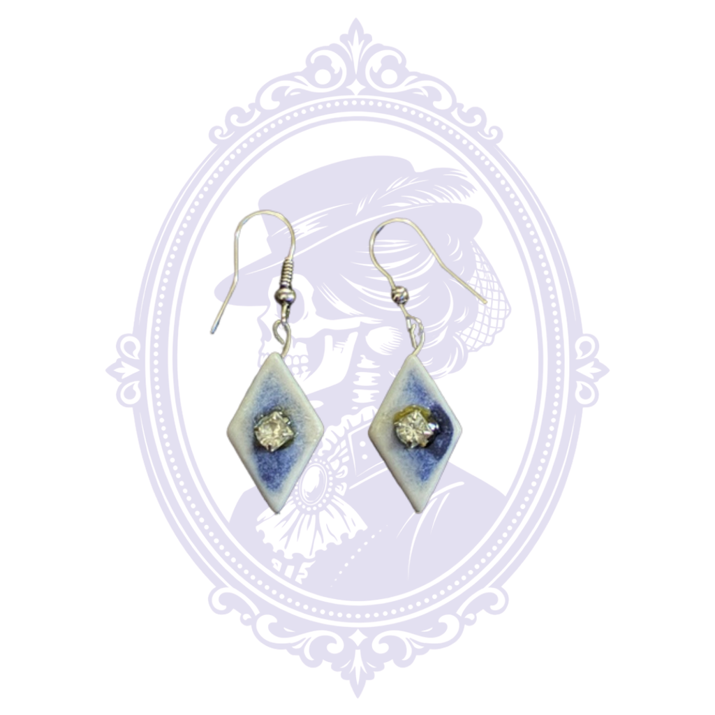 Blue and white diamond-shaped dangle earrings with clear rhinestone centers and silver-tone fishhook ear wires.