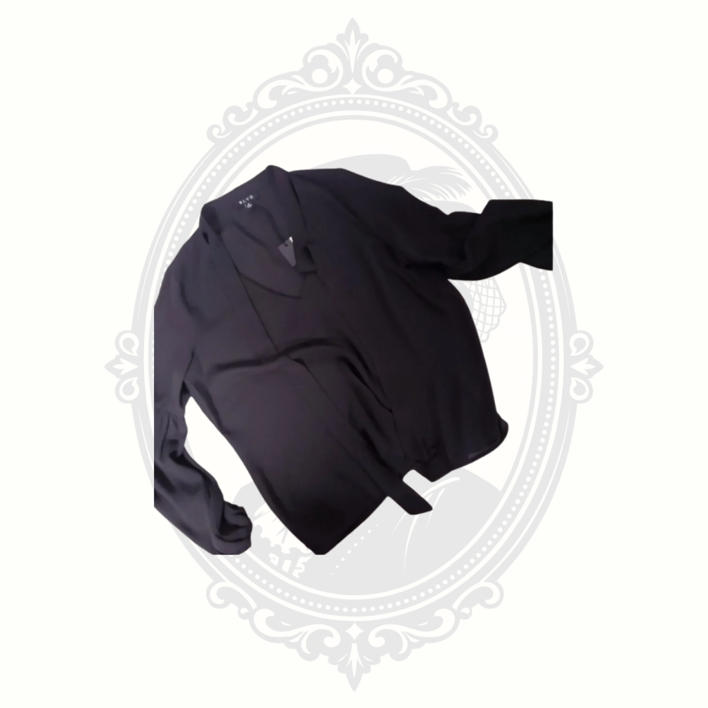 close up of tie neck choker style blouse flat lay
