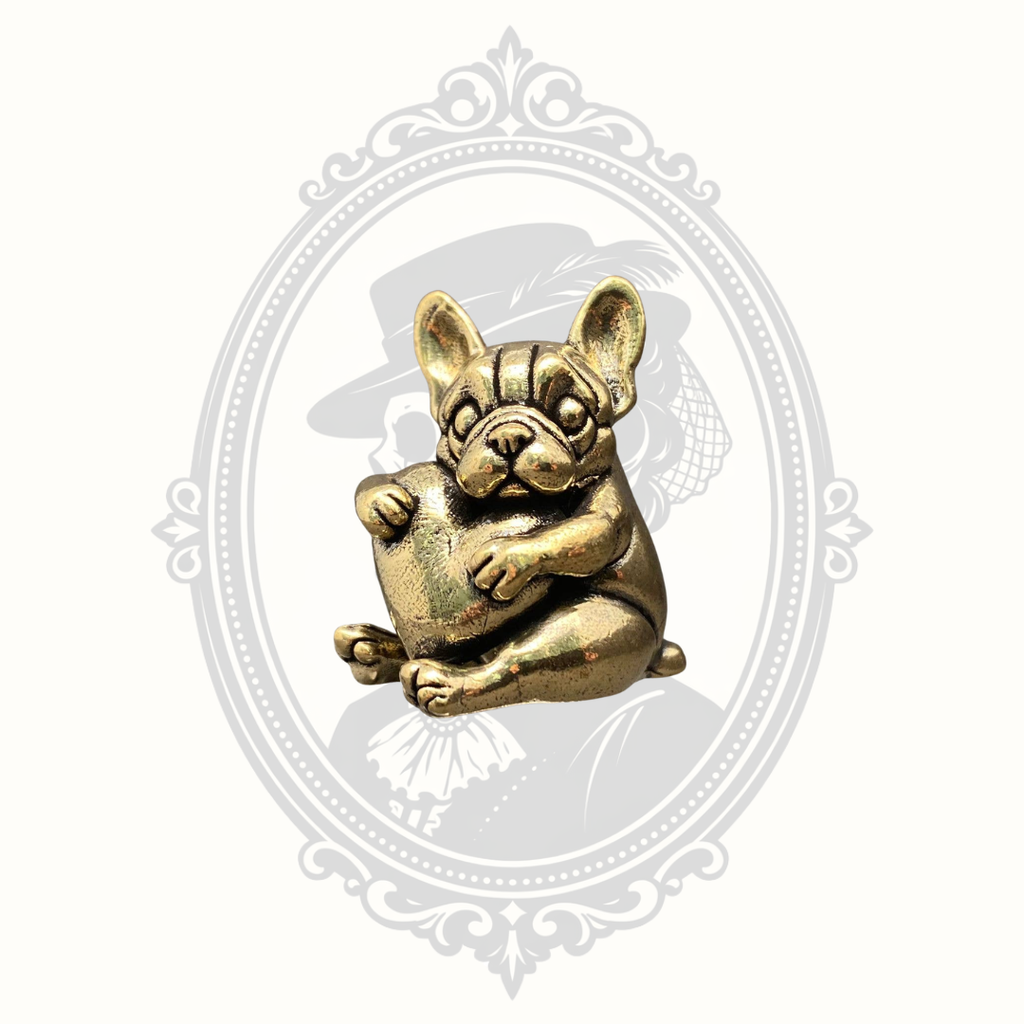 Miniature solid brass French Bulldog figurine hugging a heart, front view.
