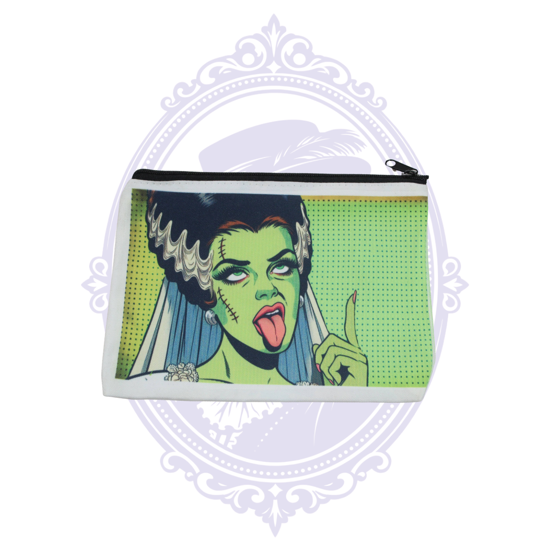 Bride of Frankenstein pop art makeup bag with green face, black and white hair and red lips