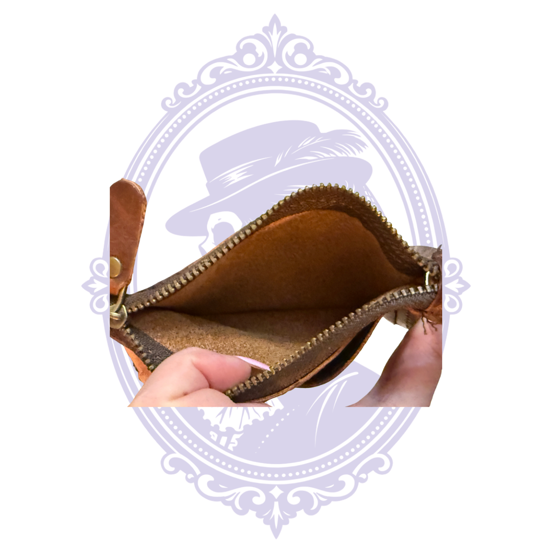 Brown leather wristlet wallet showing exterior card slots and detachable wrist strap