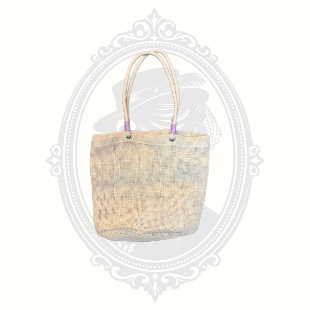 Back view of woven Capelli New York mini tote bag with natural straw texture and rope handles