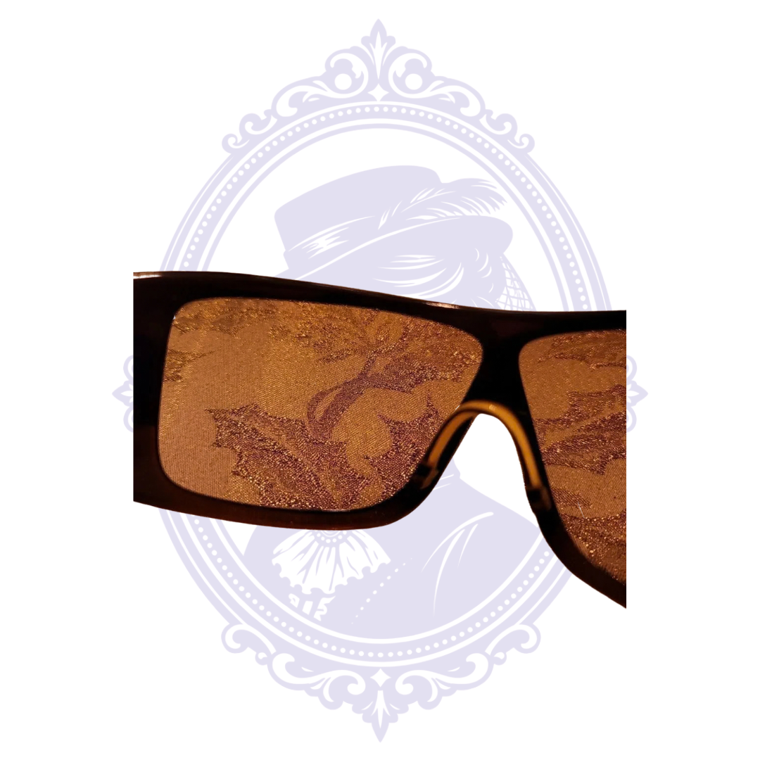 Close-up through Chanel 5086 brown sunglass lens showing lens condition