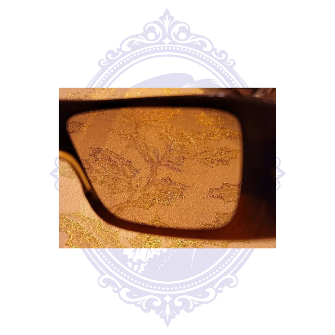 Close-up through second Chanel 5086 brown sunglass lens showing lens condition