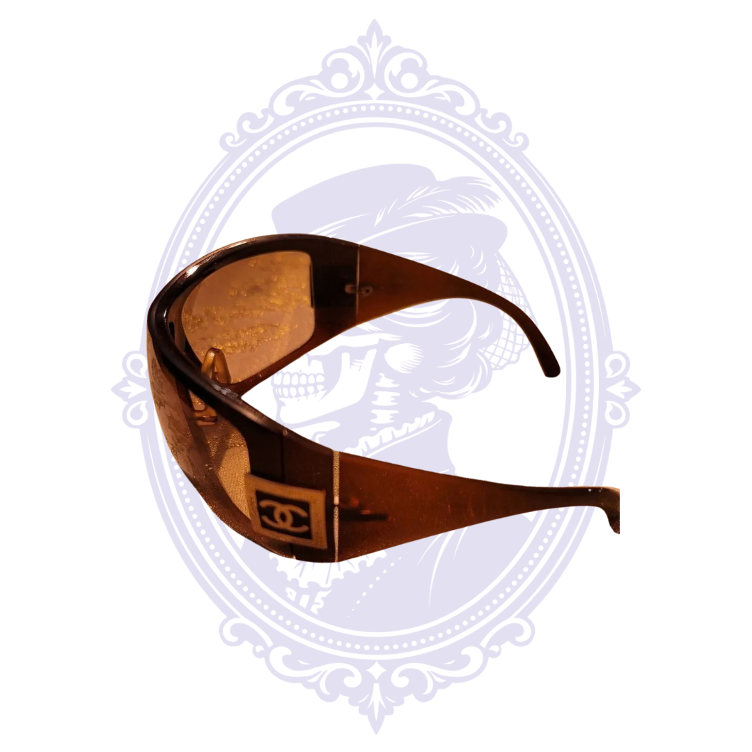 Side view of Chanel 5086 sunglasses showing brown temple and square CC logo