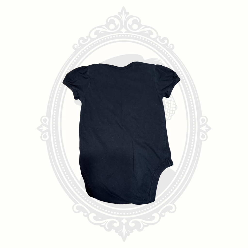 Back view of black baby onesie with short puff sleeves from The Children’s Place.