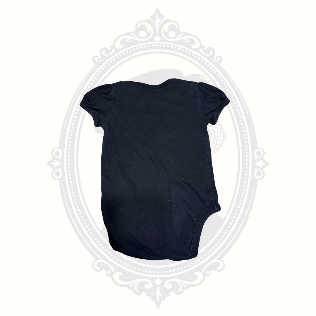 Back view of black baby onesie with short puff sleeves from The Children’s Place.