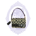 Coach Signature C black and tan wristlet with detachable black leather strap, front view