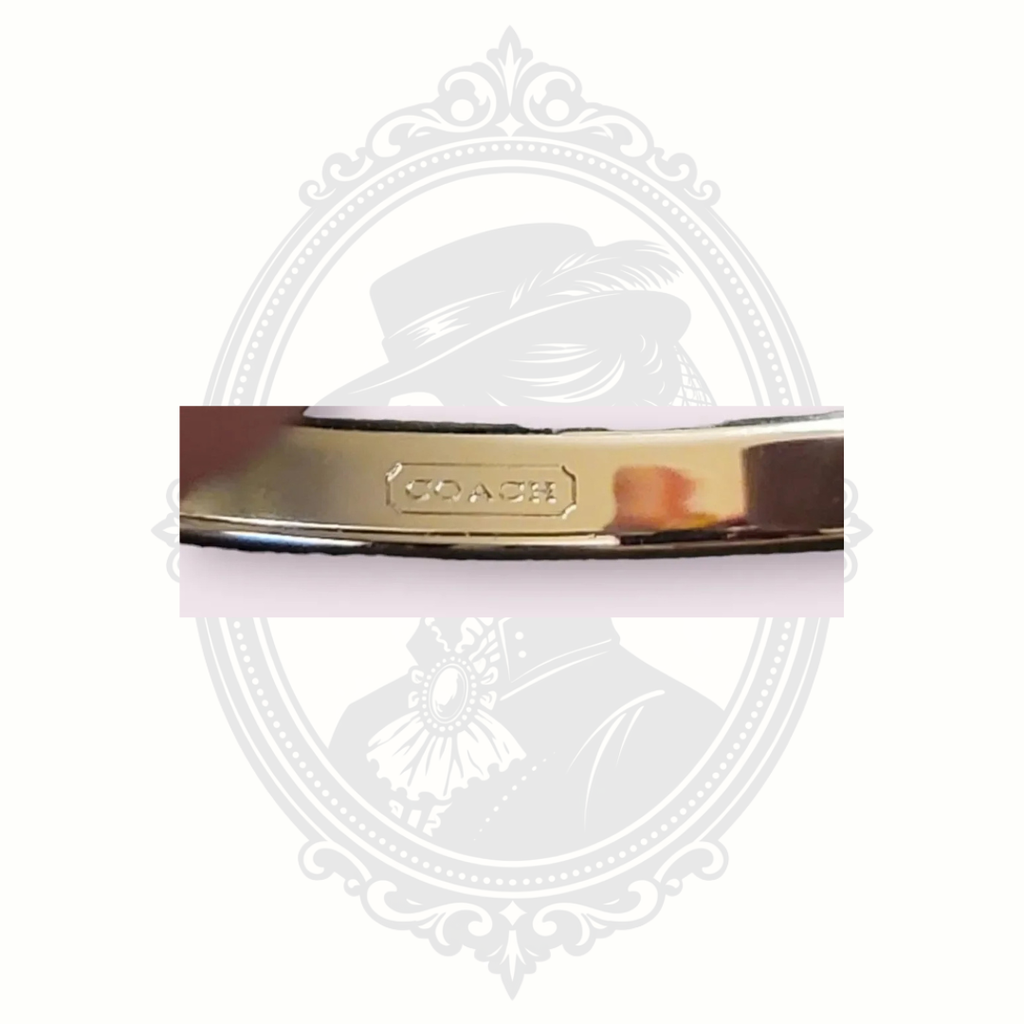Coach Silver-Tone Bangle Bracelet with Purple Enamel Accents