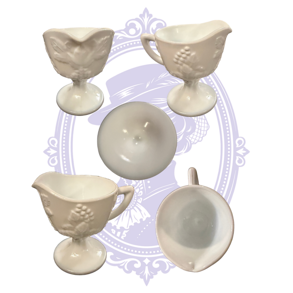 Views of footed Colony Harvest creamer and open sugar bowl showing grape pattern, handles, spout, and interiors.