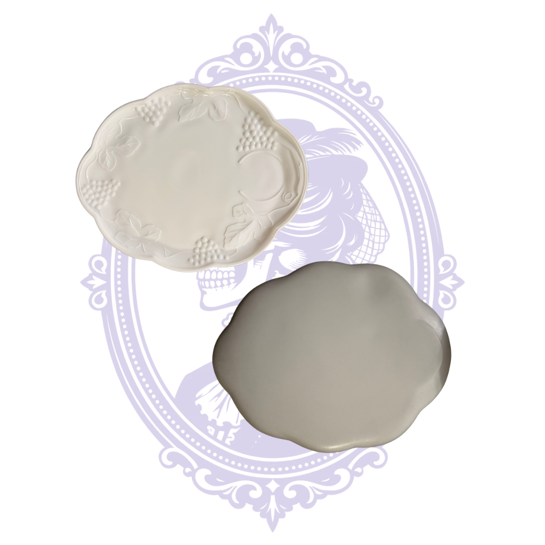 Scalloped Colony Harvest luncheon plate with grape and leaf embossing and a molded cup recess.