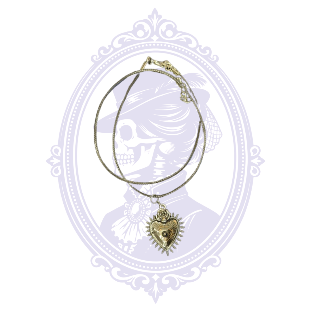 Full view of black gothic heart and eye pendant necklace with double cord and adjustable clasp.
