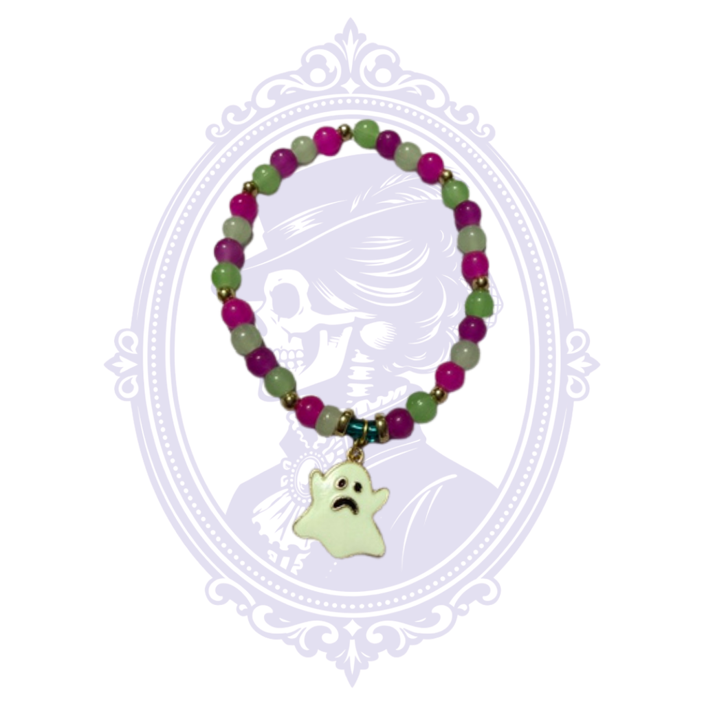 Full-length view of purple and green glass bead stretch bracelet with gold-tone accents and dangling pale ghost charm.
