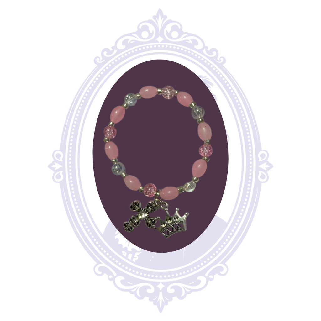Pink and iridescent beaded stretch bracelet with silver-tone cross and crown charms, hand-assembled by Mrs. Bones.
