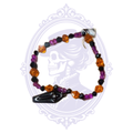 Orange, purple and black glass bead stretch bracelet with a glossy black coffin charm, hand-assembled by Mrs. Bones.