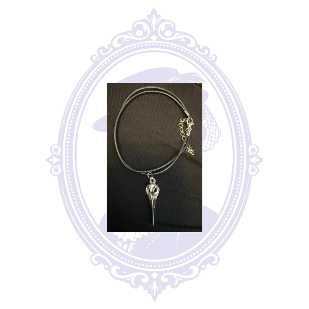 Black cord necklace with silver-tone plague doctor mask pendant, lobster clasp and extender chain, hand-assembled by Mrs. Bones.