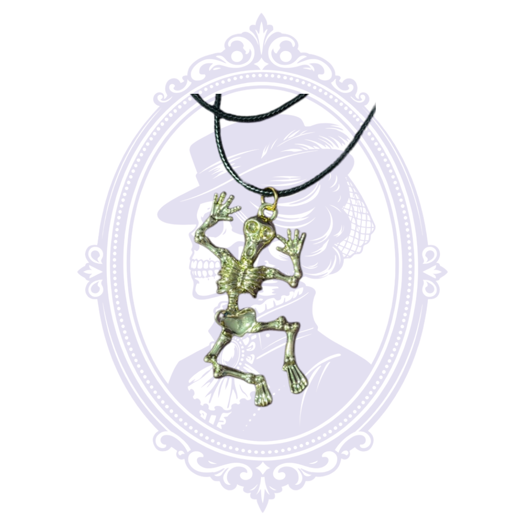 Close-up of a detailed full skeleton pendant with raised arms and dangling jointed legs on a black cord necklace.
