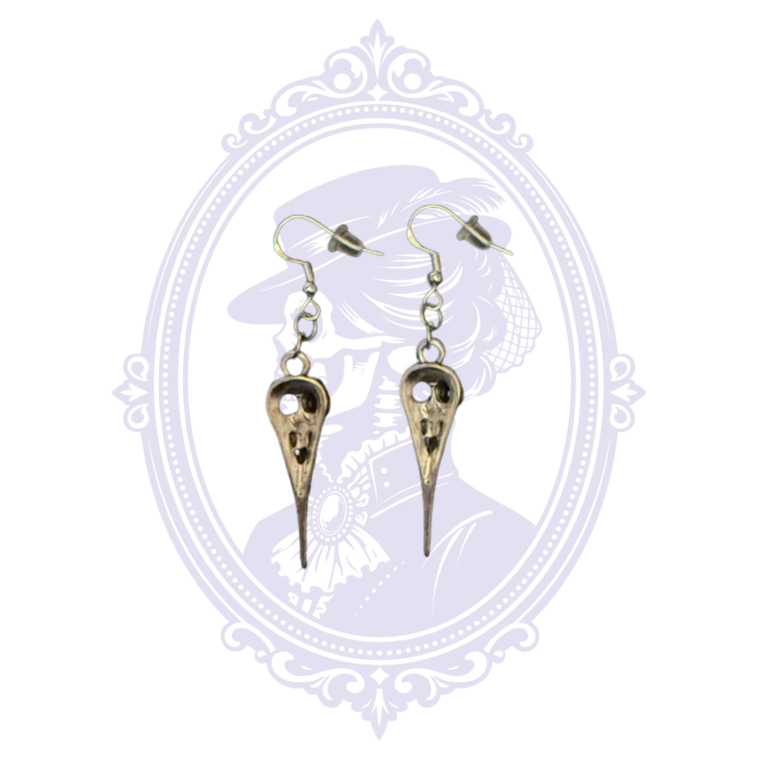 Detailed view of Cupboard Crafted antiqued silver-tone plague doctor earrings with connecting rings and fishhook ear wires.