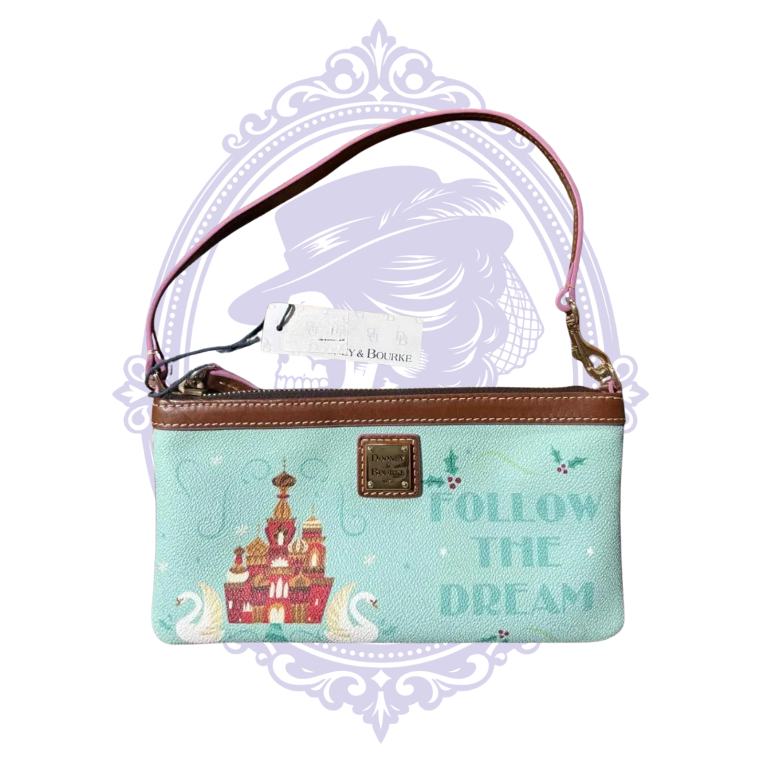 Reverse view of Disney Nutcracker wristlet with castles and holiday motifs