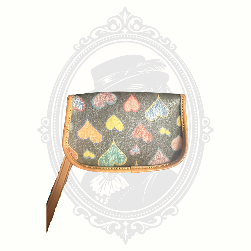 Back view of Dooney & Bourke heart print wristlet with leather trim and wrist strap
