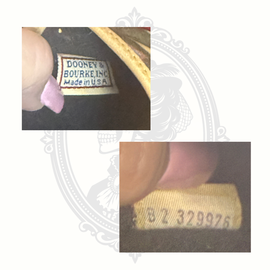 Dooney & Bourke serial number tag inside wristlet for authenticity verification