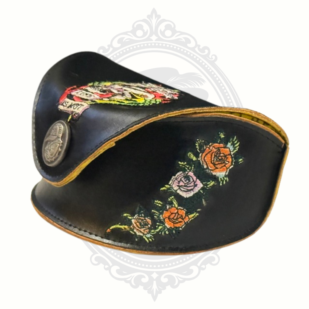 Black Ed Hardy leather sunglasses case with floral embroidery on a white background