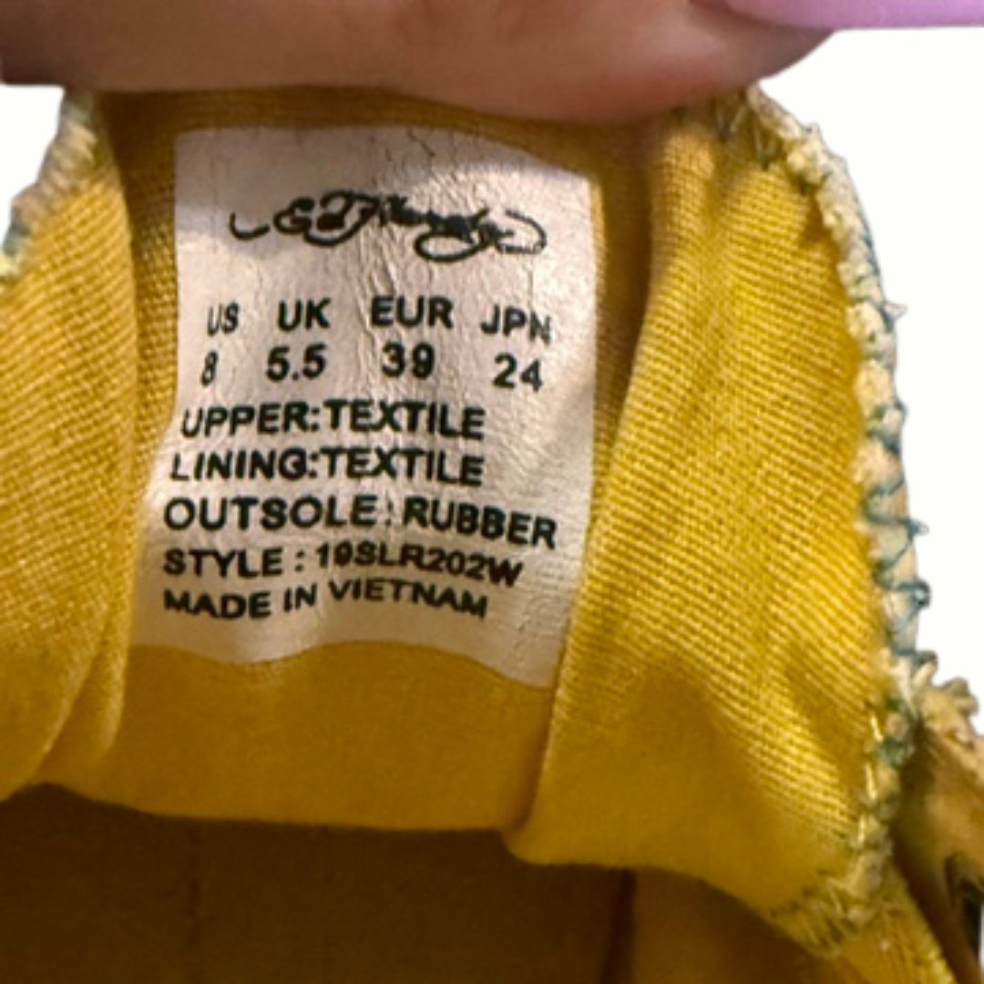 Close-up of Ed Hardy shoe label showing size information and textile material details