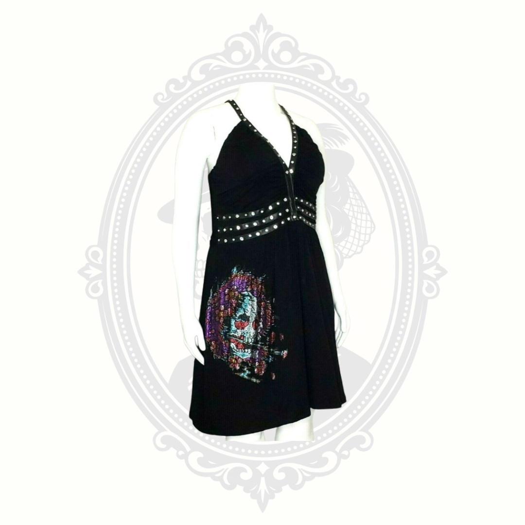 Side angle view of black Ed Hardy skull dress with gothic-inspired rhinestone detailing.