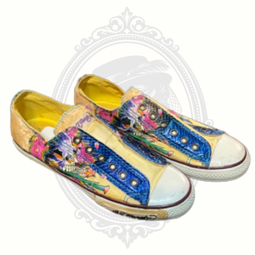 Side profile of Ed Hardy sneakers with detailed tattoo-style skull and floral graphics