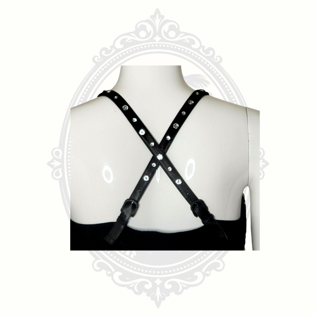 Detail of studded cross-back strap design on black Ed Hardy dress.