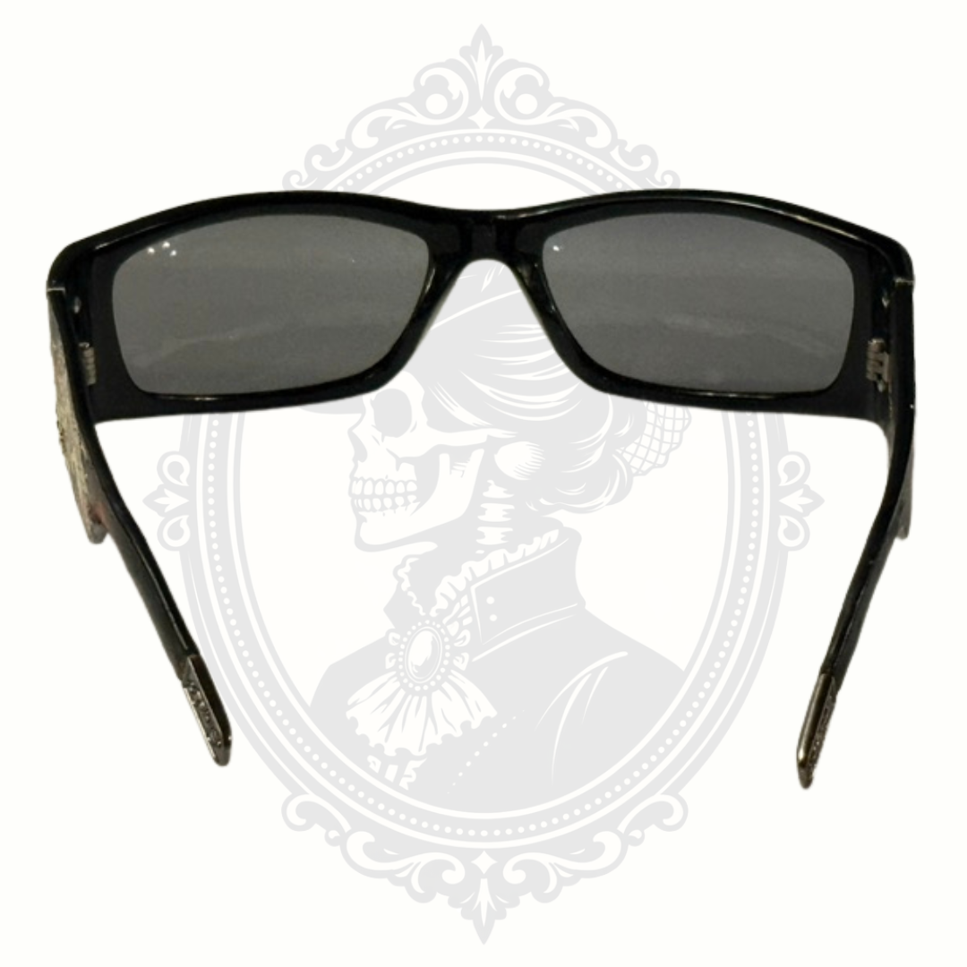 Black sunglasses with dark lenses on a decorative white background