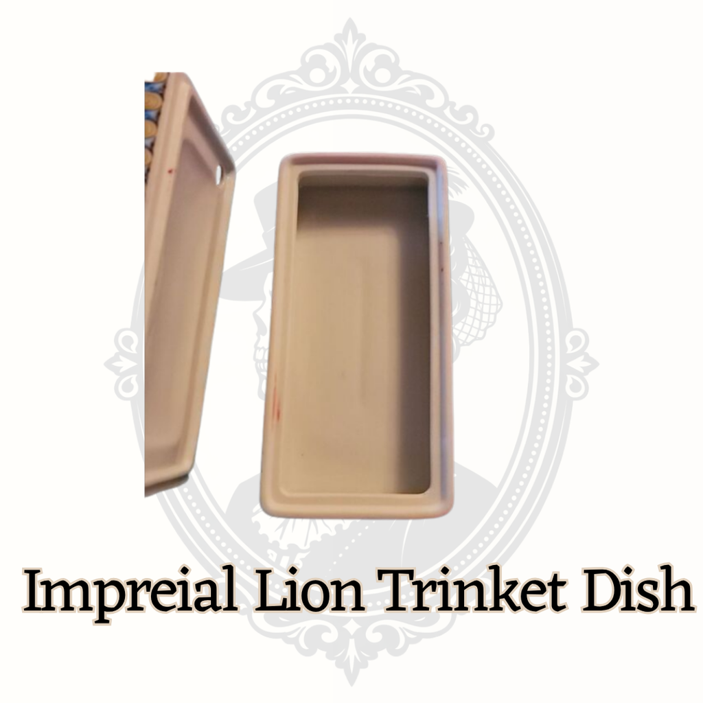 Open Elizabeth Arden lion trinket dish showing interior storage compartment