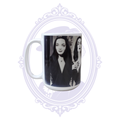 First Ladies of Goth 15 oz mug featuring black-and-white portraits of Morticia Addams and Elvira.