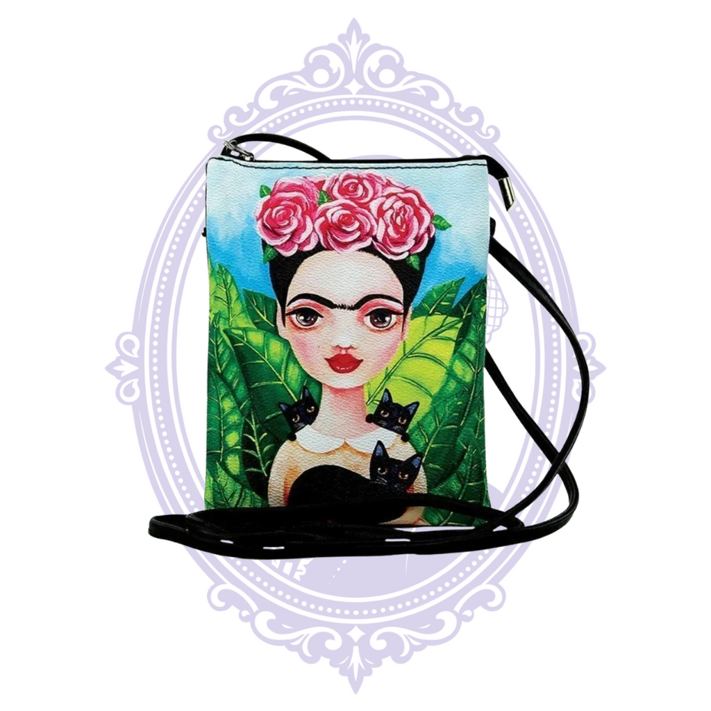 Close-up of Frida-inspired crossbody bag with pink roses, tropical foliage and three black cats