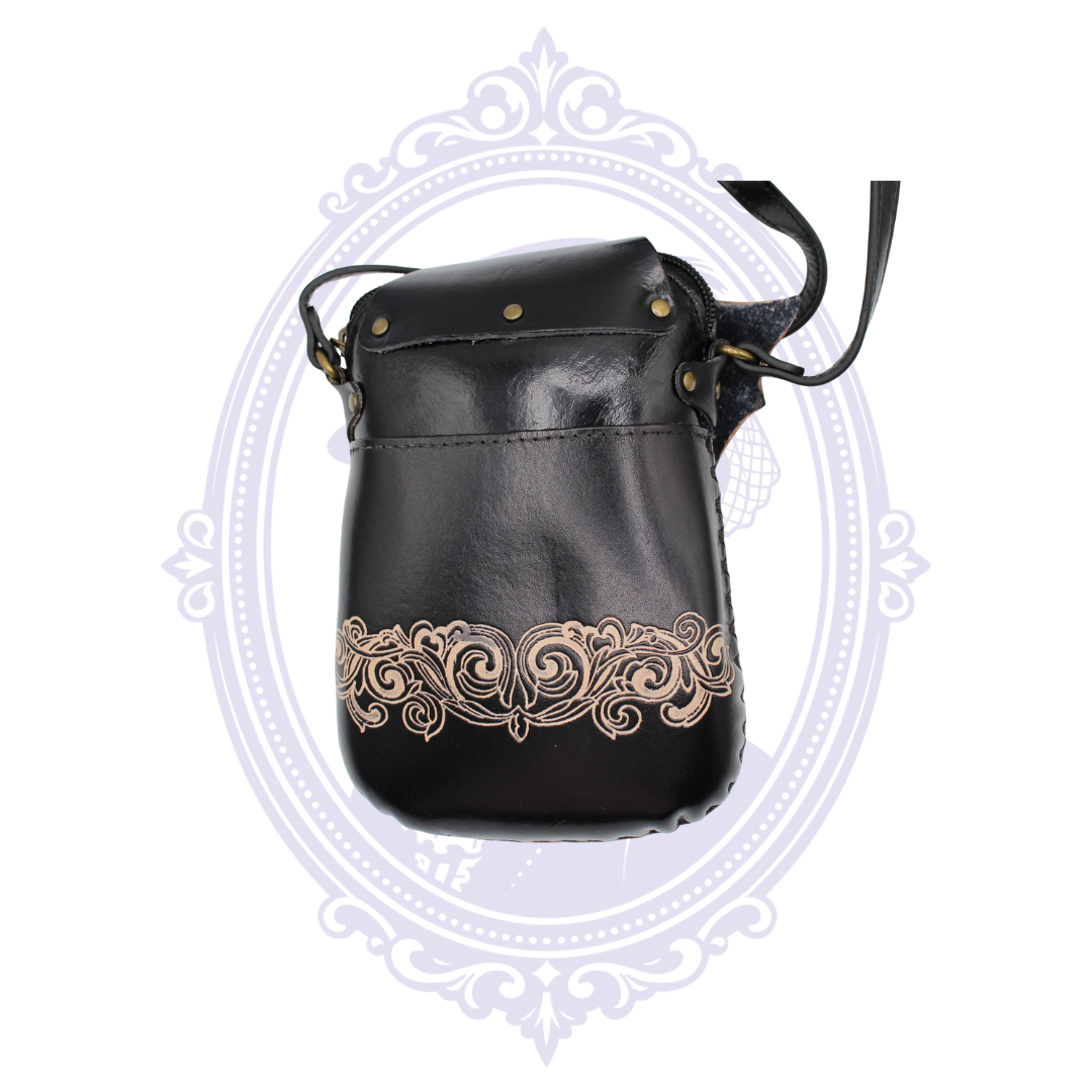 Back of black genuine leather bat crossbody phone pouch showing exterior pocket and adjustable strap