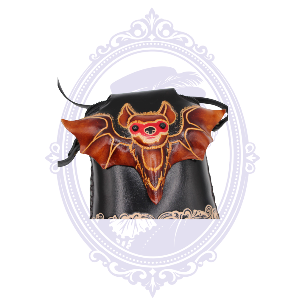 Close view of dimensional brown leather bat design on black genuine leather crossbody phone pouch