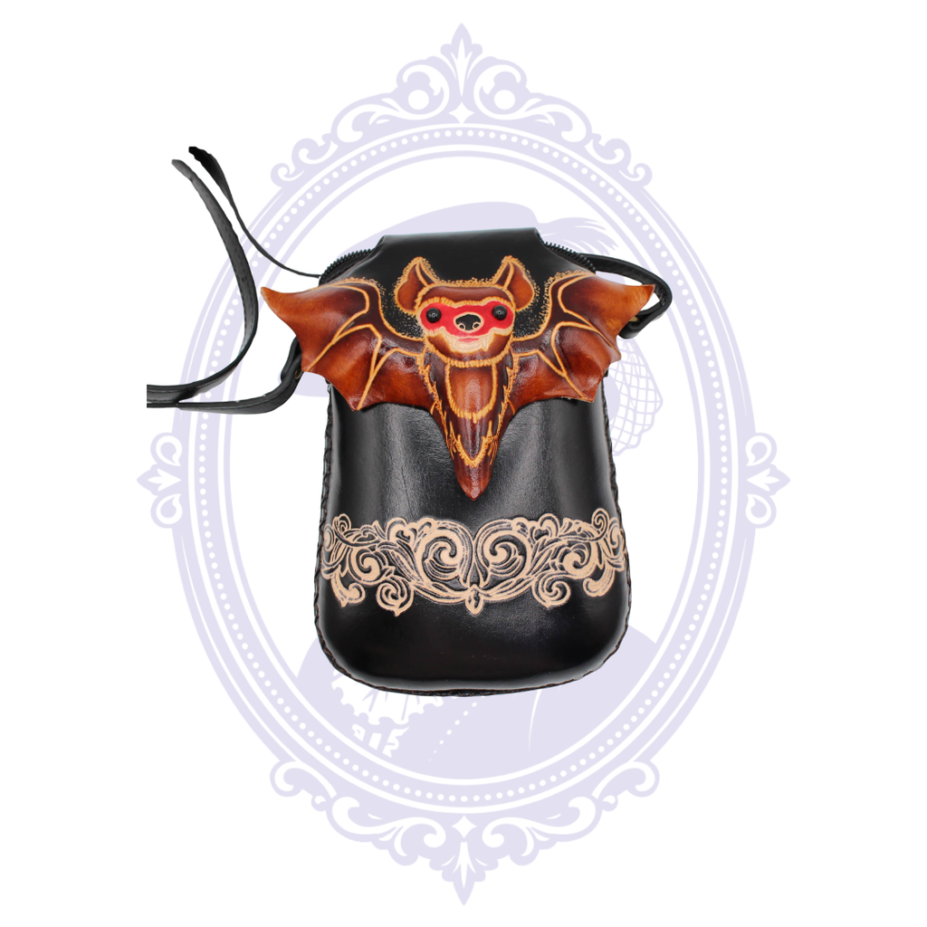 Handmade black leather crossbody phone pouch with dimensional bat design and decorative floral tooling