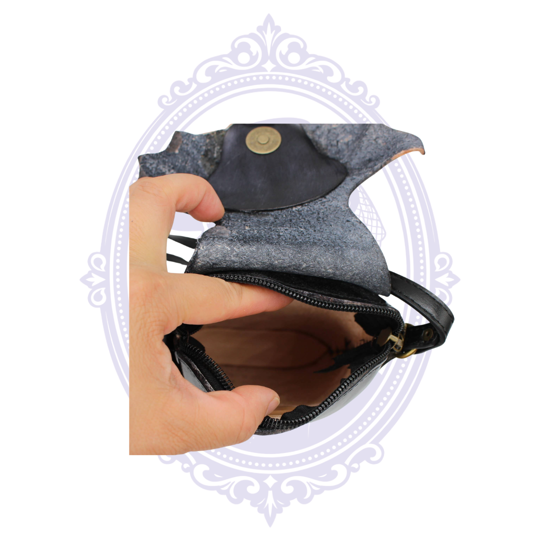 Open genuine leather bat crossbody phone pouch showing zippered main compartment and magnetic flap closure