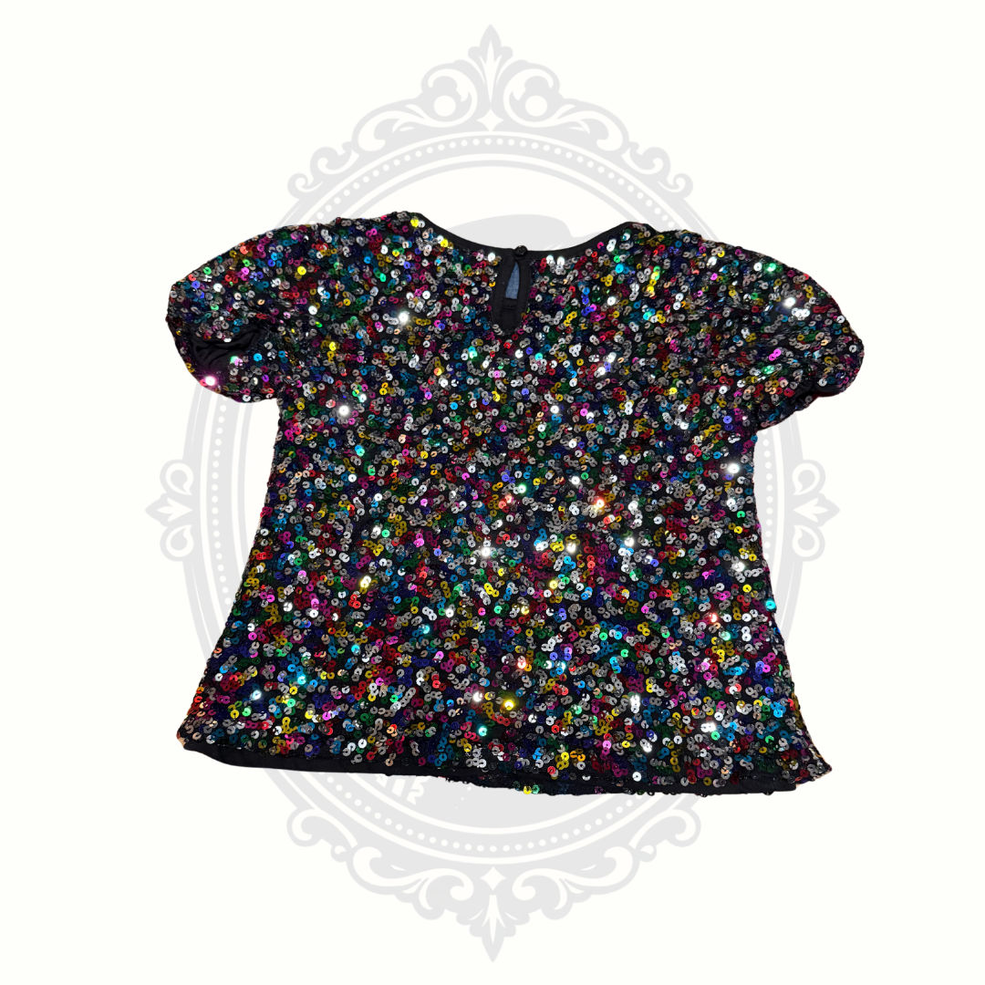 Back view of girls sequin top showing keyhole button closure