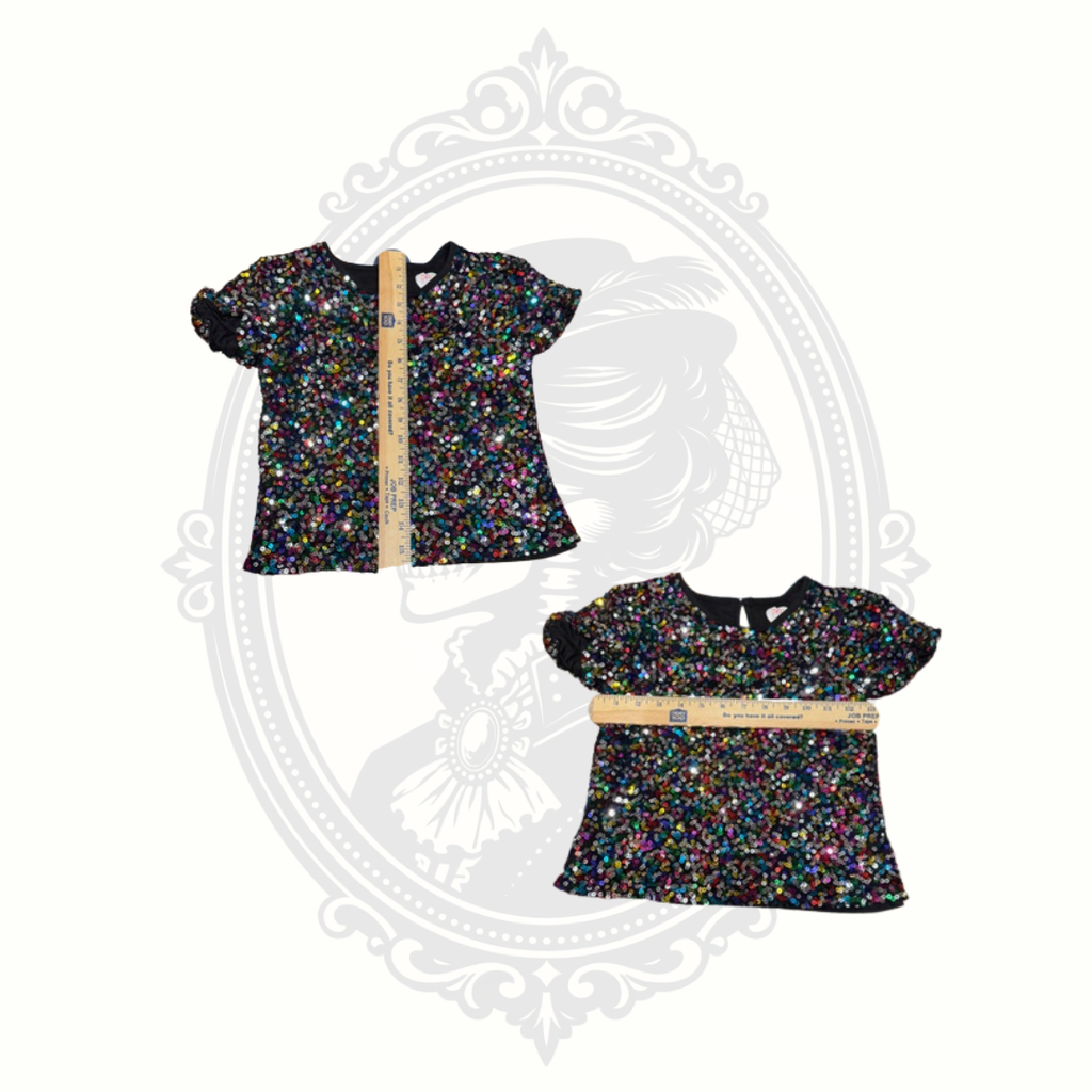 Girls sequin top size 7 with measurement guide shown across chest and length