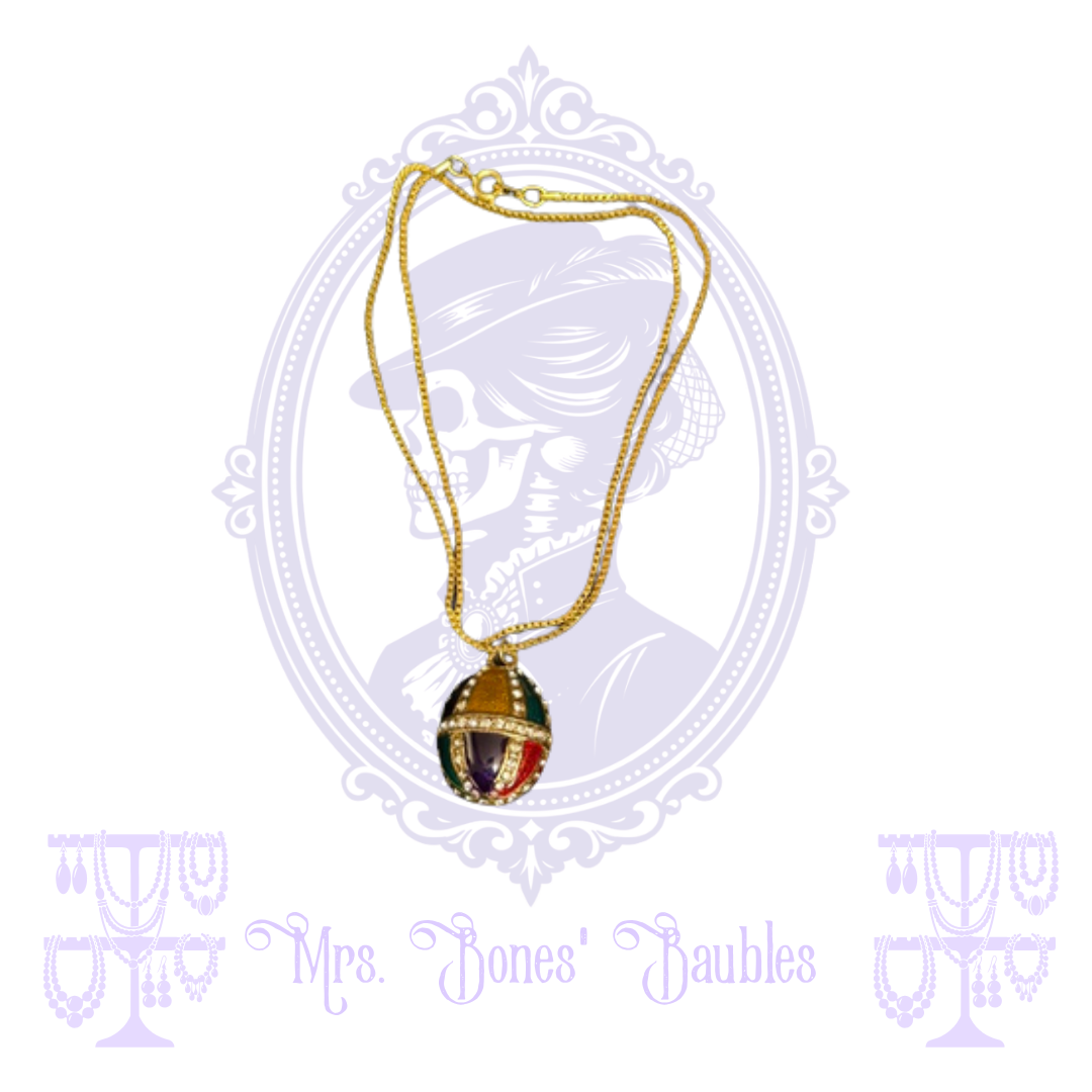 Gold-tone necklace with multicolor egg-shaped pendant and clear rhinestone accents
