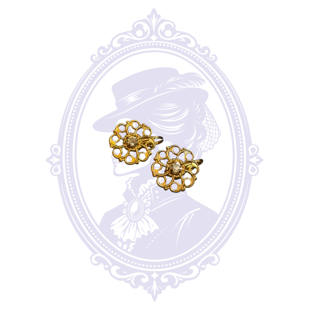 Gold-tone openwork floral clip-on earrings with clear rhinestone-style centers shown from the front.
