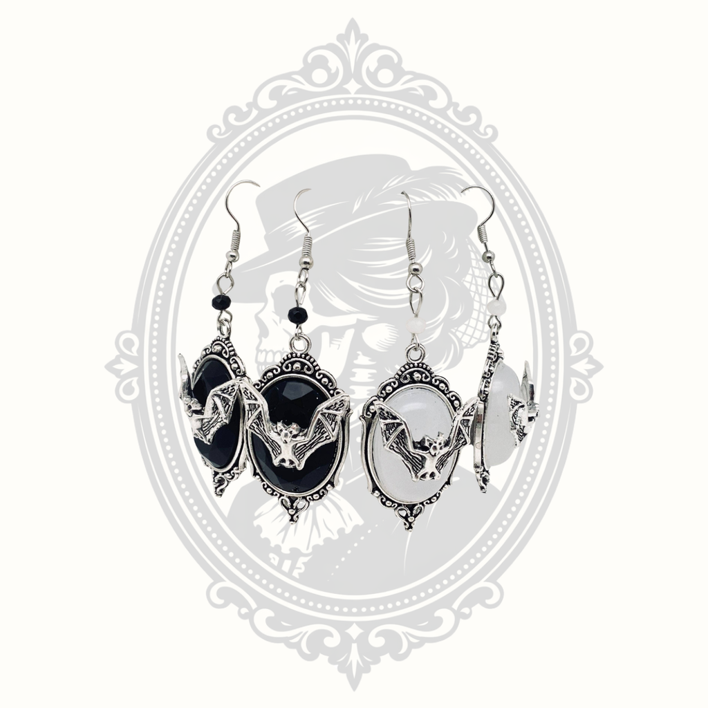 Gothic bat cameo drop earrings shown in black and white gemstone styles.