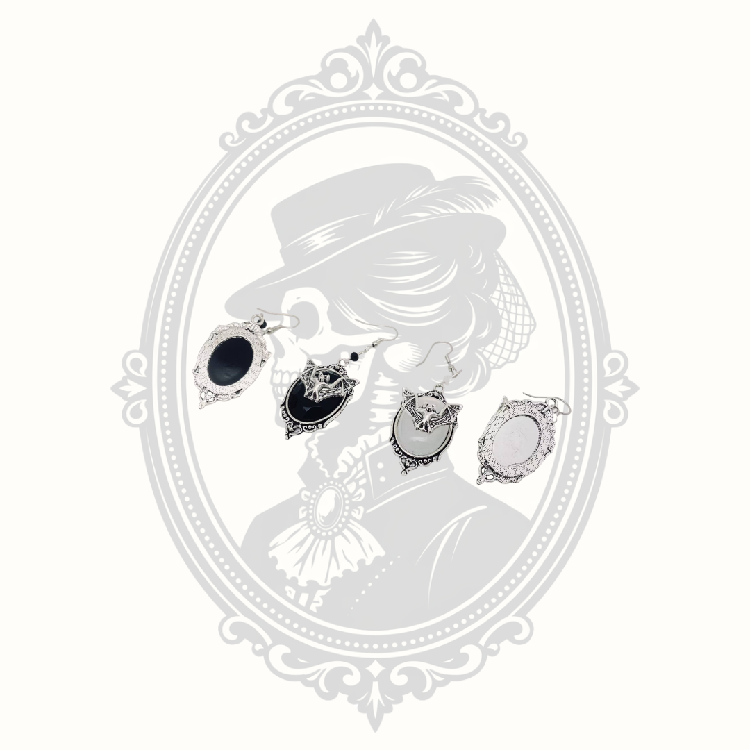 Front and back views of black and white Gothic bat cameo drop earrings.